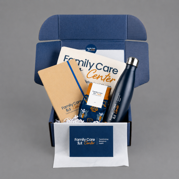 Swag Box containing branded items with 'Family Care Center' logo on a gray background
