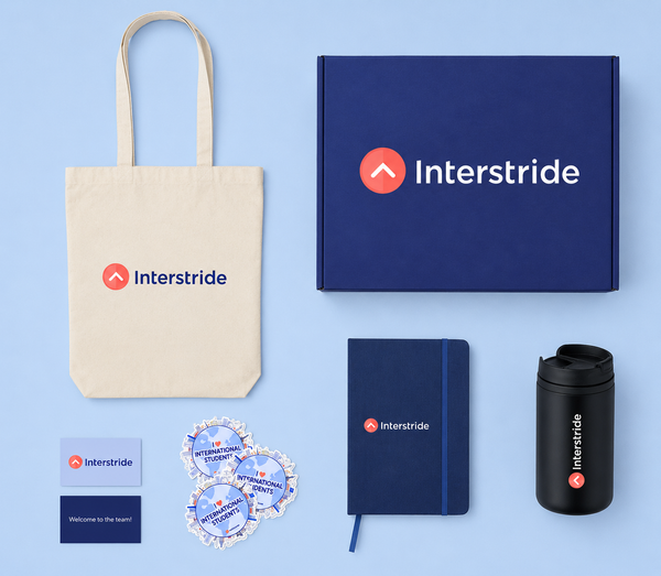 Collection of Interstride branded items including a tote bag, box, notebook, mug, and stickers on a blue background.