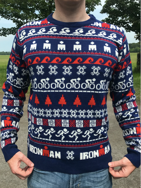 Custom knitted Christmas sweaters with a company logo across the chest
